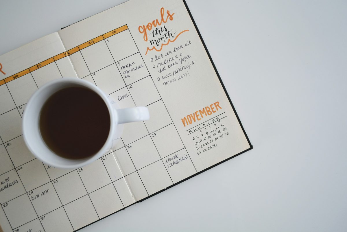 how to get debt free in 2 years - calendar with milestones and sunrise